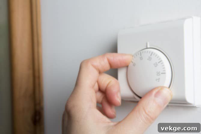 Digital smart thermostat displaying a comfortable indoor temperature setting