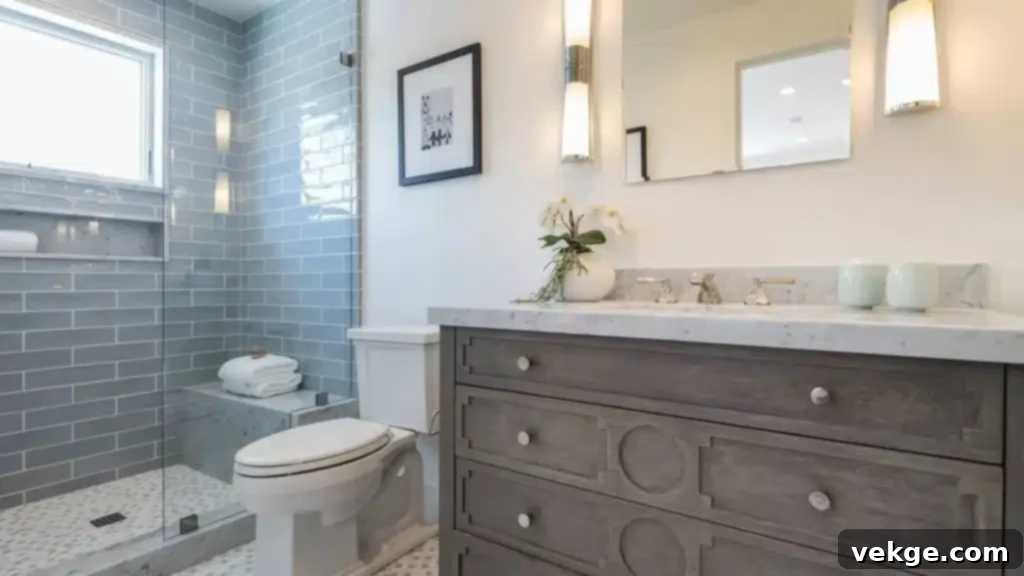Elegant bathroom remodel with a freestanding tub, large window, and modern fixtures