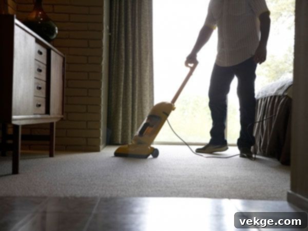 How to Clean Your Home Efficiently: A person cleaning a kitchen counter