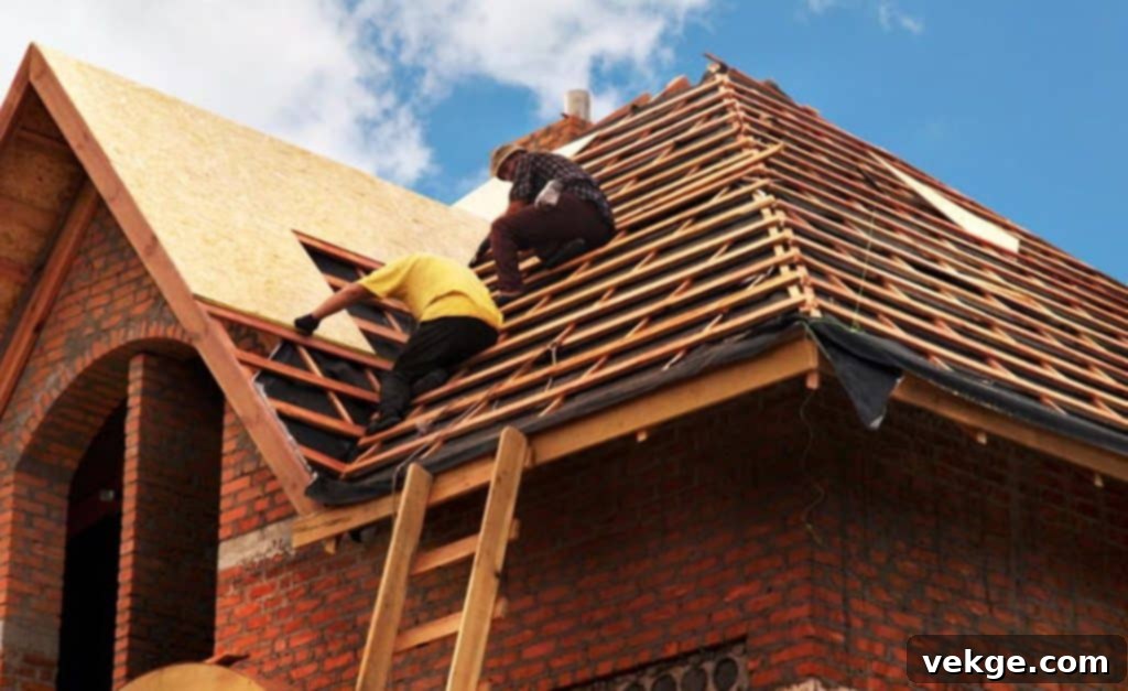 Choosing a Flat Roofing Company: A contractor reviewing plans on a flat roof.