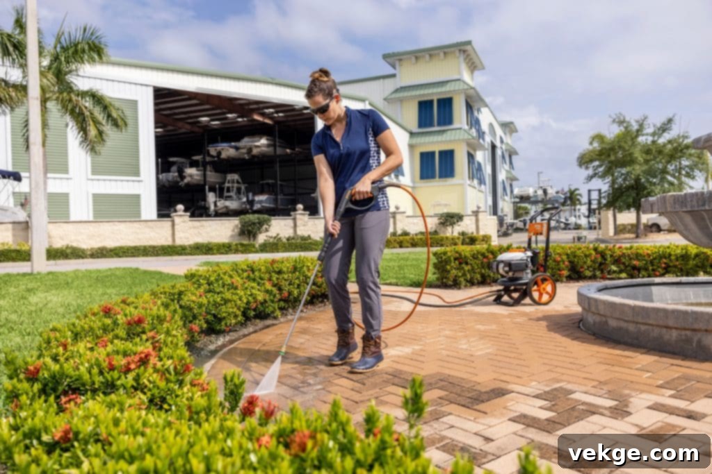 Safety Measures with Jet Washers - Person wearing protective gear while pressure washing