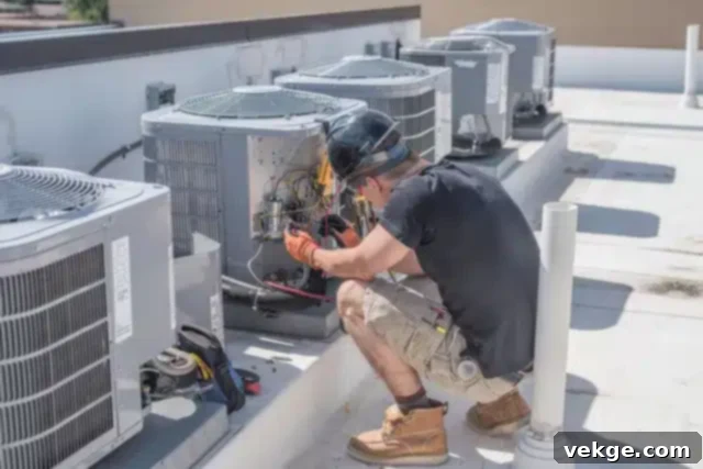 HVAC technician performing professional maintenance on an outdoor condenser unit.