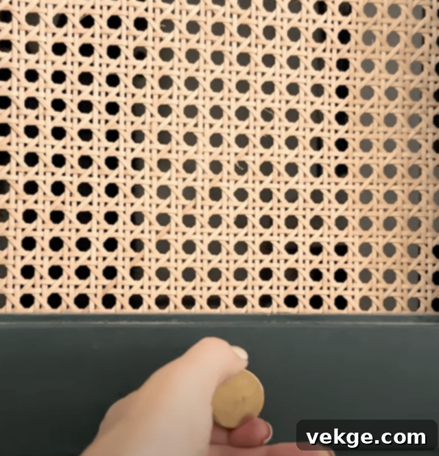 Install the new door knob and perform any final paint touch-ups to complete the bifold door makeover.