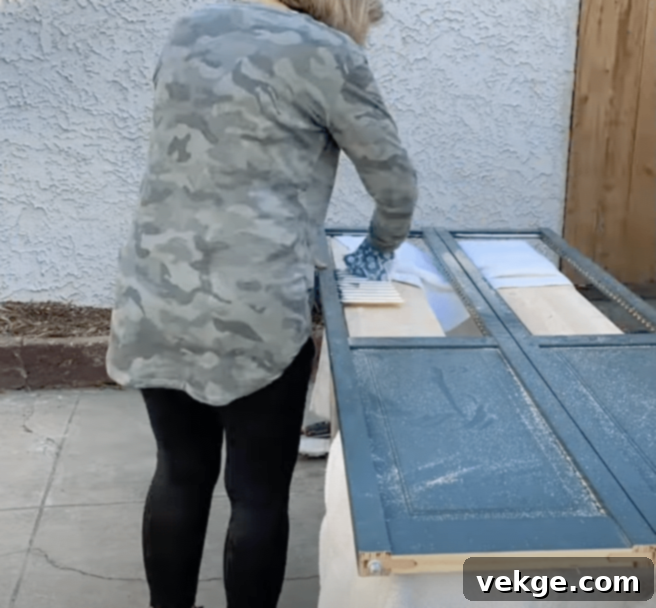 Carefully remove existing louvers from the bifold door using a circular saw or jigsaw.
