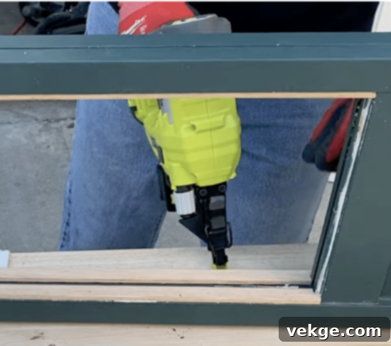 Cut and install wood screen molding around the louver openings with a nail gun.