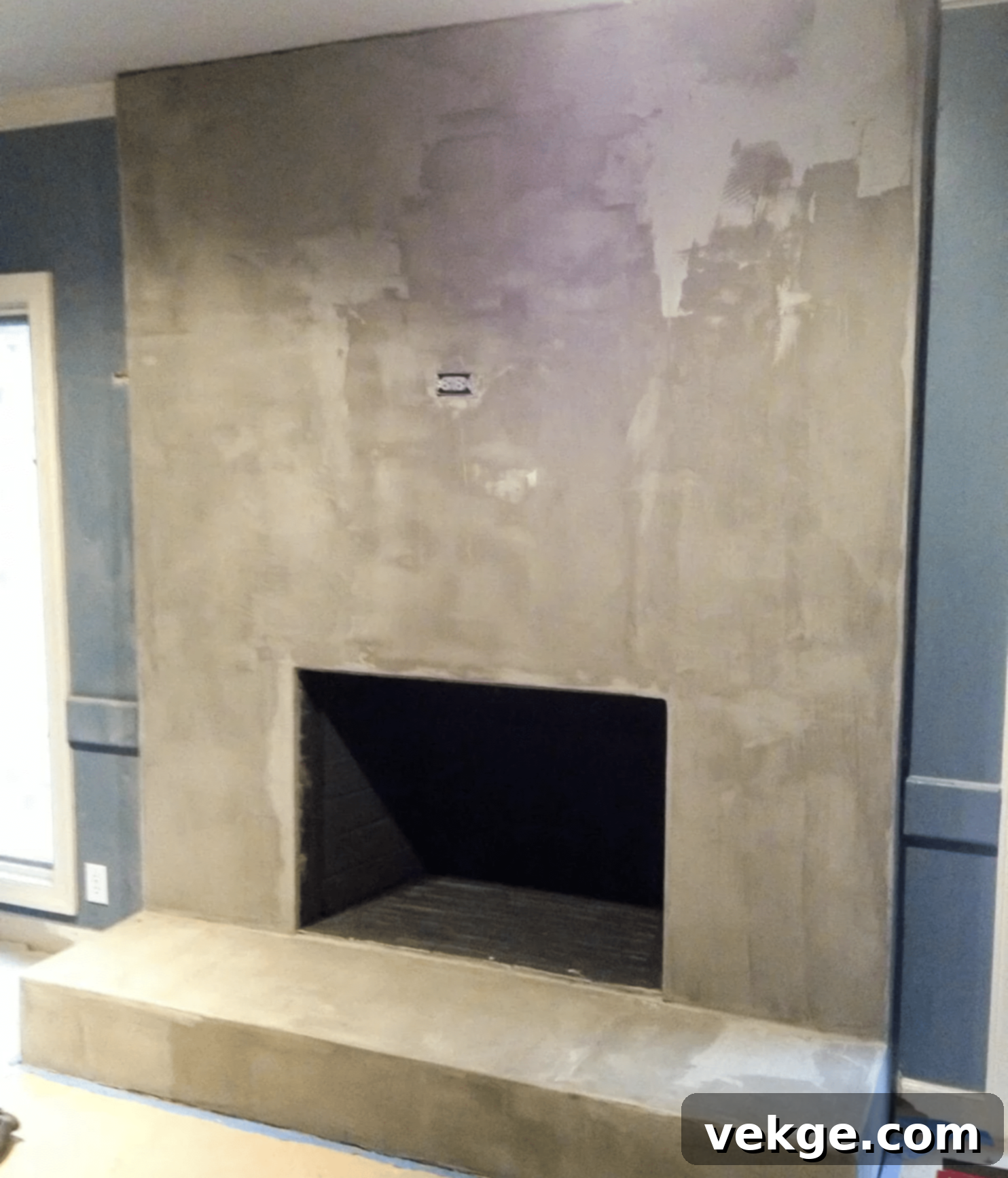 Optional sanding and sealing steps for a DIY concrete fireplace makeover.