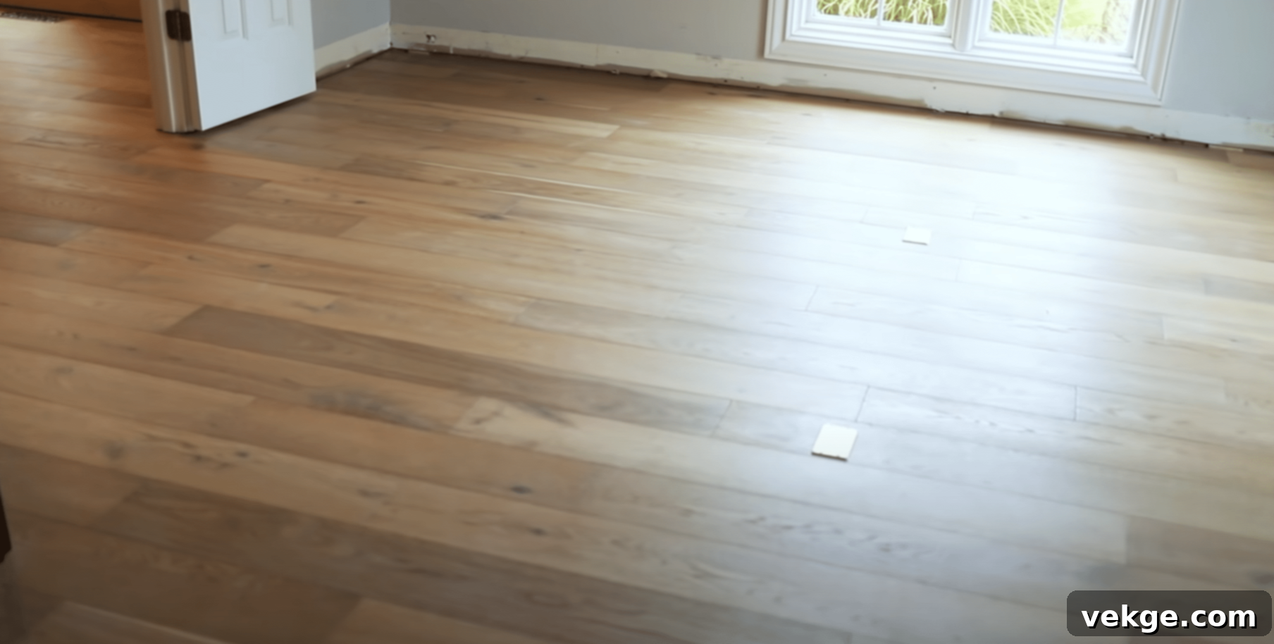 Step 5: Continue installing hardwood planks row by row and finalize with baseboards and trim