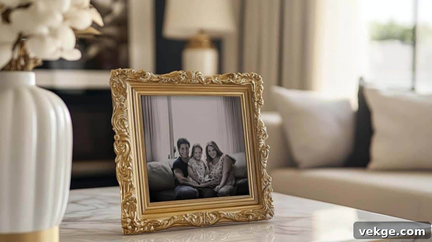 Ornate gold picture frame displaying a black and white photo on a console table