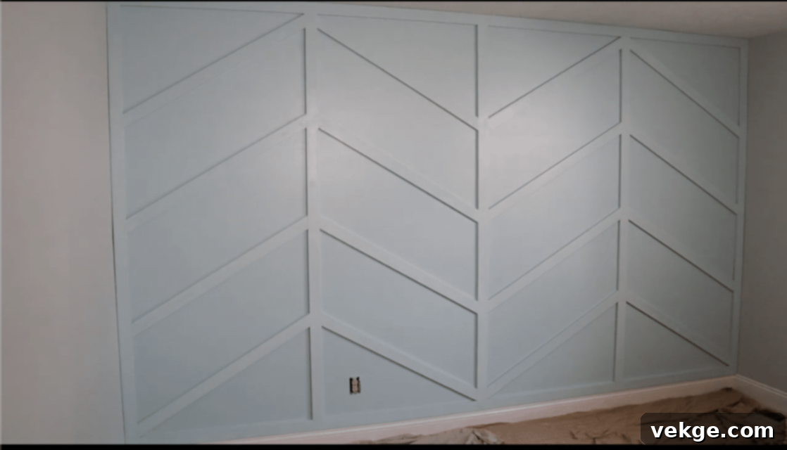 Step-by-step DIY guide to creating a modern wood trim accent wall, from preparation to final painting.