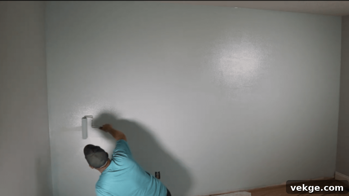 Prepare the wall by painting it your chosen color and allowing it to dry completely for at least 7 days.