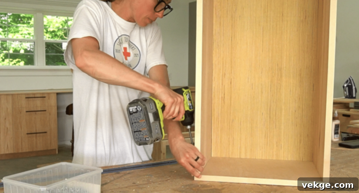 Step 5: Build and Install the Drawer by assembling plywood pieces with dado grooves and attaching to slides