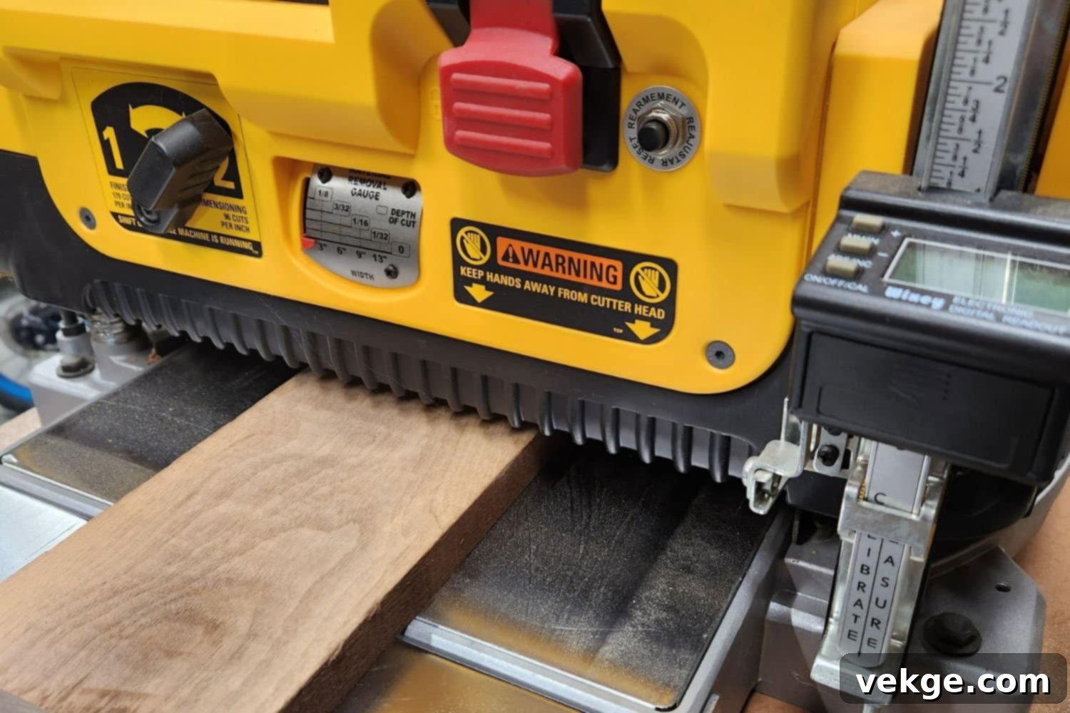 Thickness planer, a machine for making wood boards flat and even, ranging $300-$800.