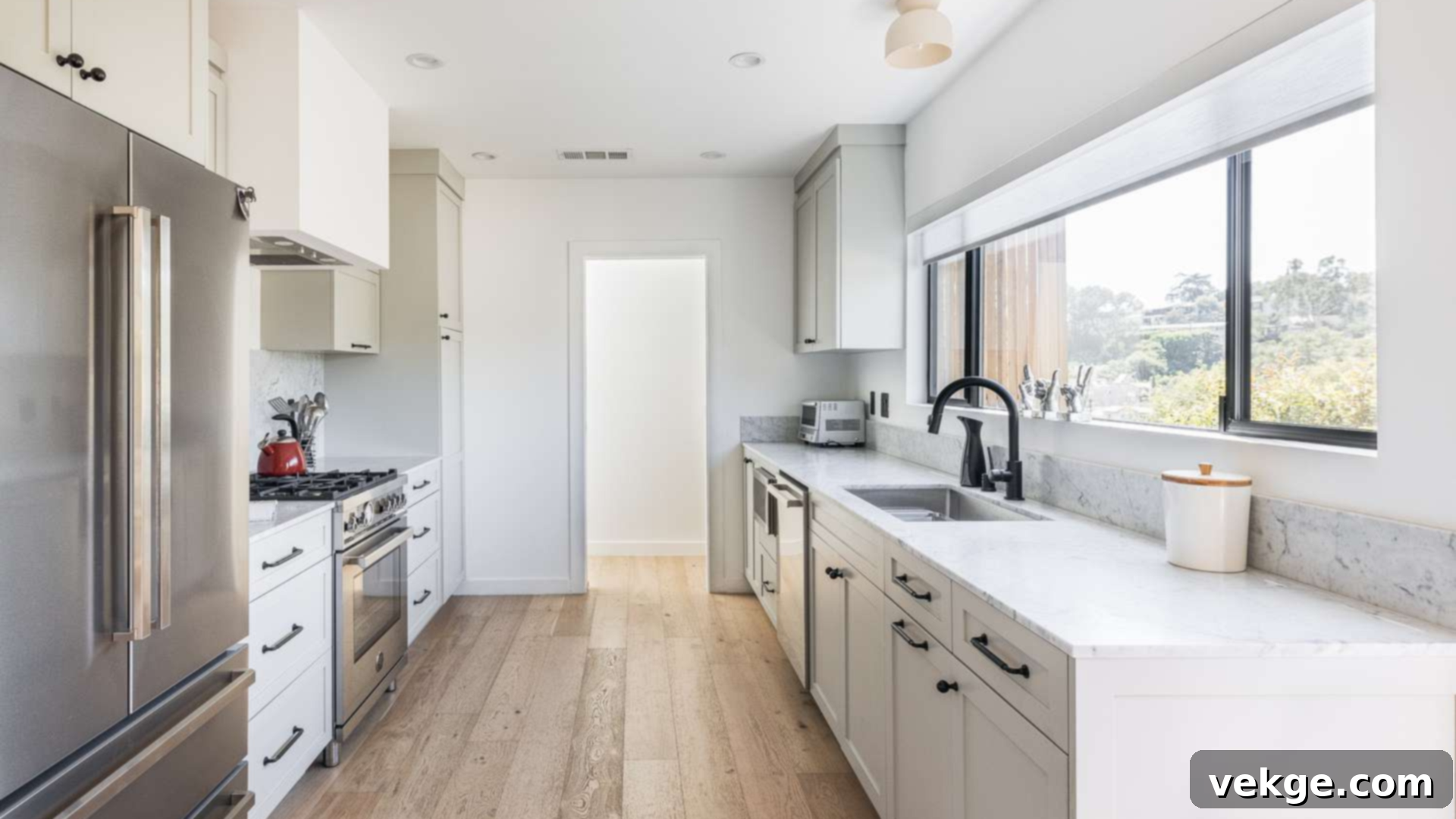 A galley kitchen layout with two parallel walls of cabinets and countertops forming a walkway