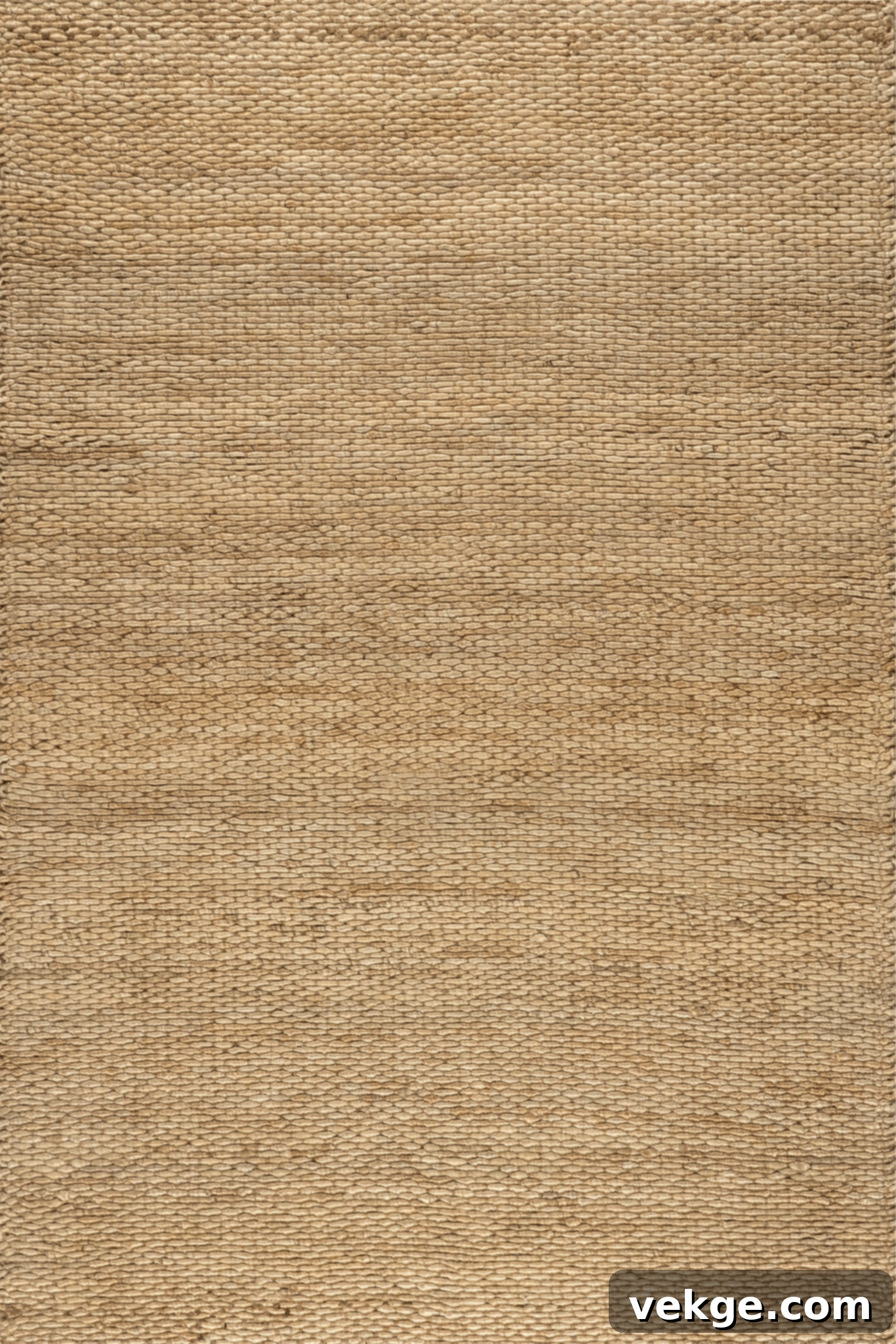 A handwoven jute-blend rug from RugsUSA, adding natural texture and warmth to a minimalist living space.
