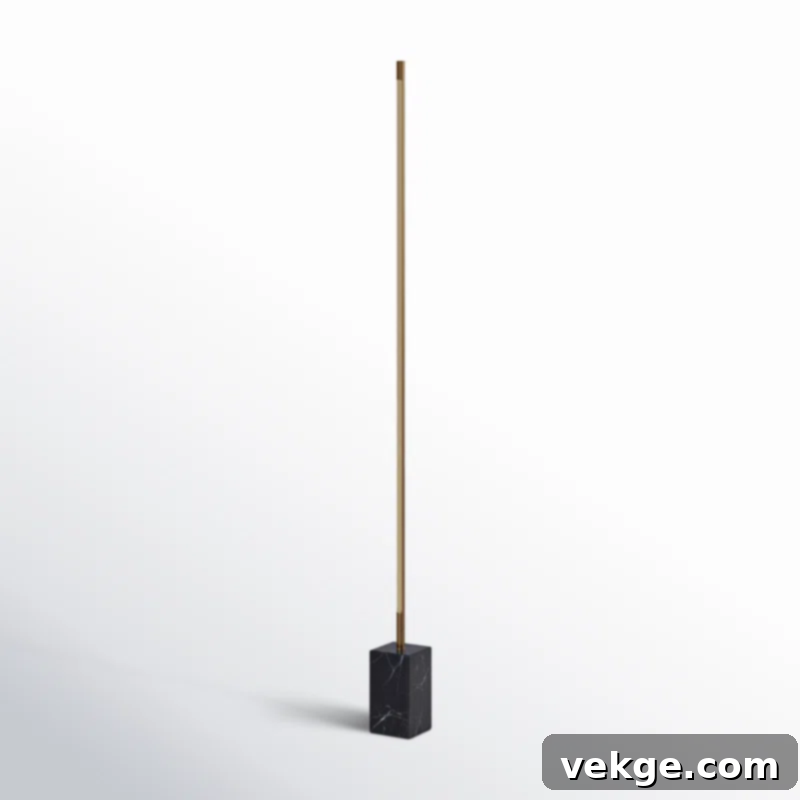 Ericson 65-inch Dimmable Floor Lamp with a marble plinth base and linear metal shade, providing elegant lighting in a modern space.