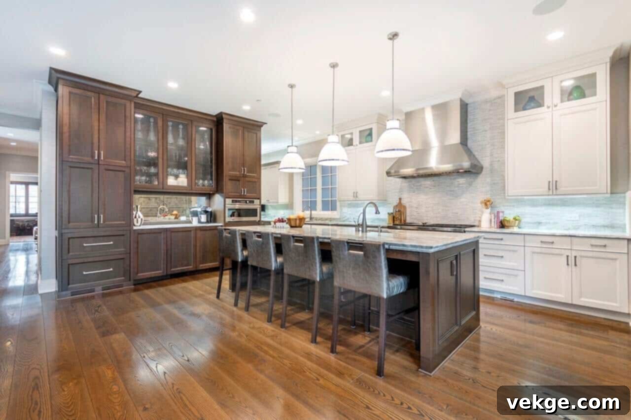 Luxurious kitchen featuring a large marble island and classic cabinetry