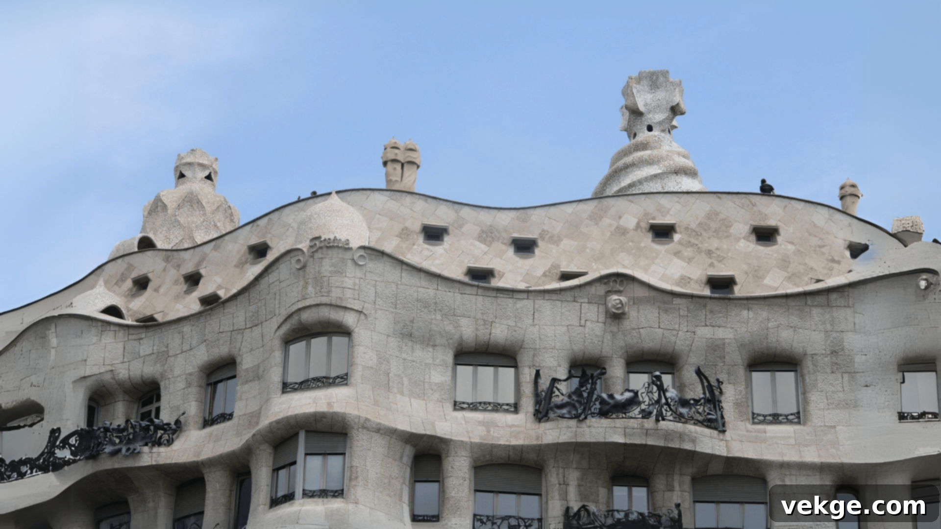 La Pedrera (Casa Mila) in Barcelona, an apartment building by Gaudi with a wavy stone facade and no straight lines.