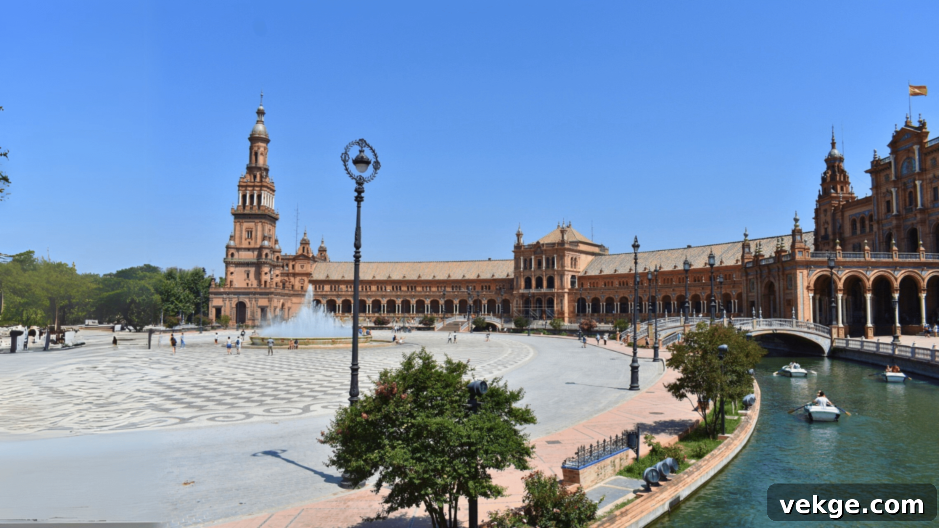 The grand semicircular Plaza de Espana in Seville, with its distinctive ceramic tiles and bridges.