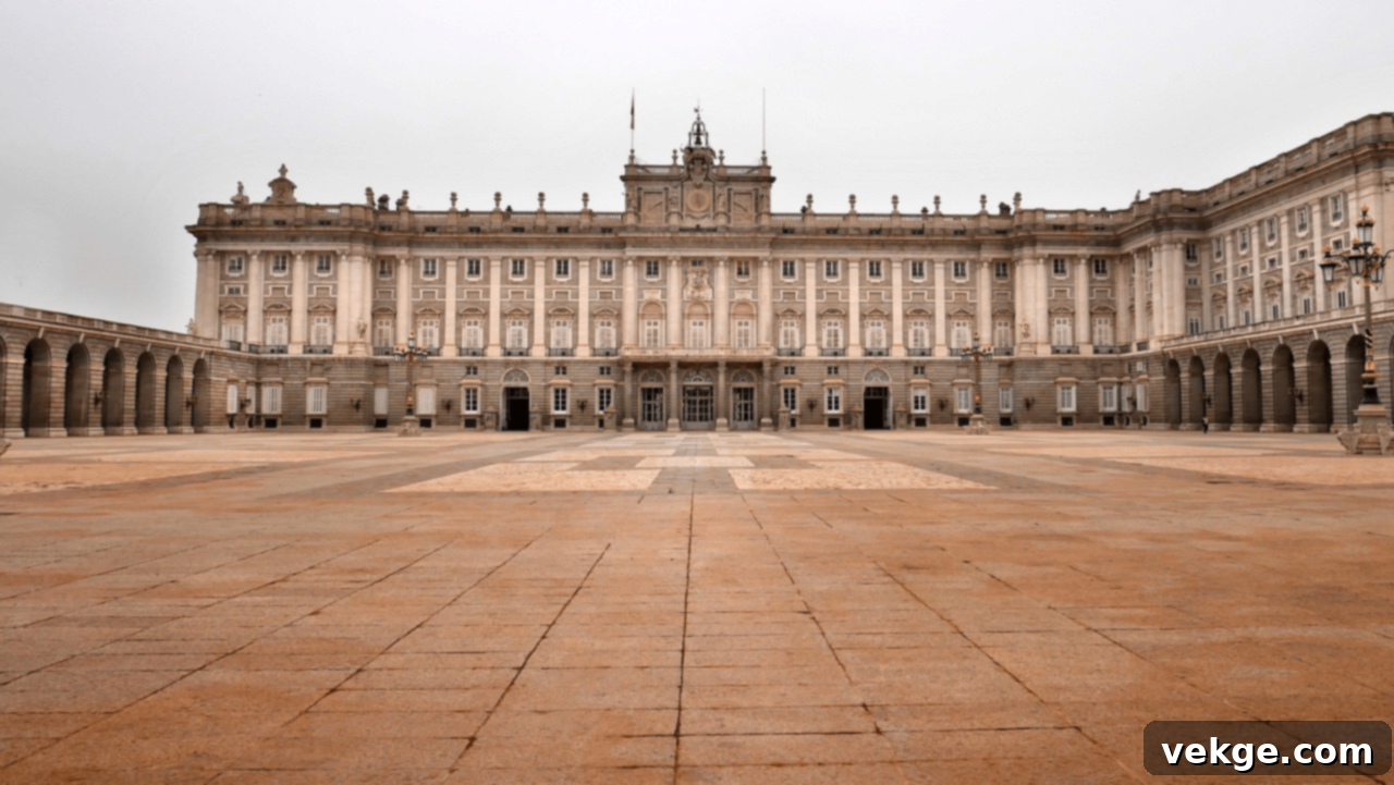 The impressive facade of the Royal Palace of Madrid, a grand Baroque building symbolizing Spanish monarchy.