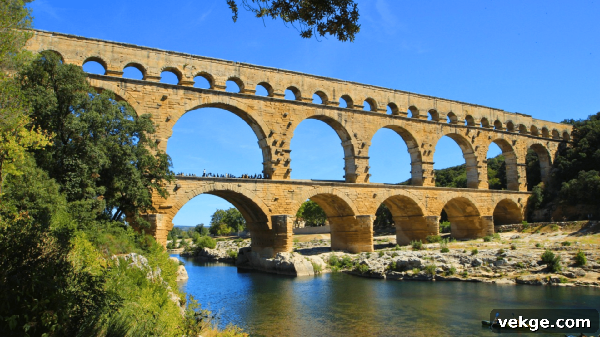 Pont du Gard, an ancient Roman aqueduct bridge, majestically spanning the Gardon river.