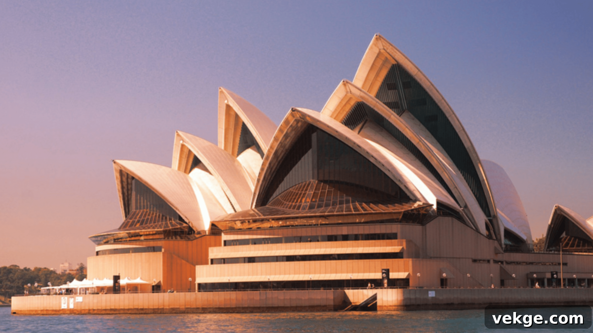 The iconic Sydney Opera House in Australia, with its distinctive white shell-shaped sails on Sydney Harbour, a masterpiece of 20th-century modern architecture.