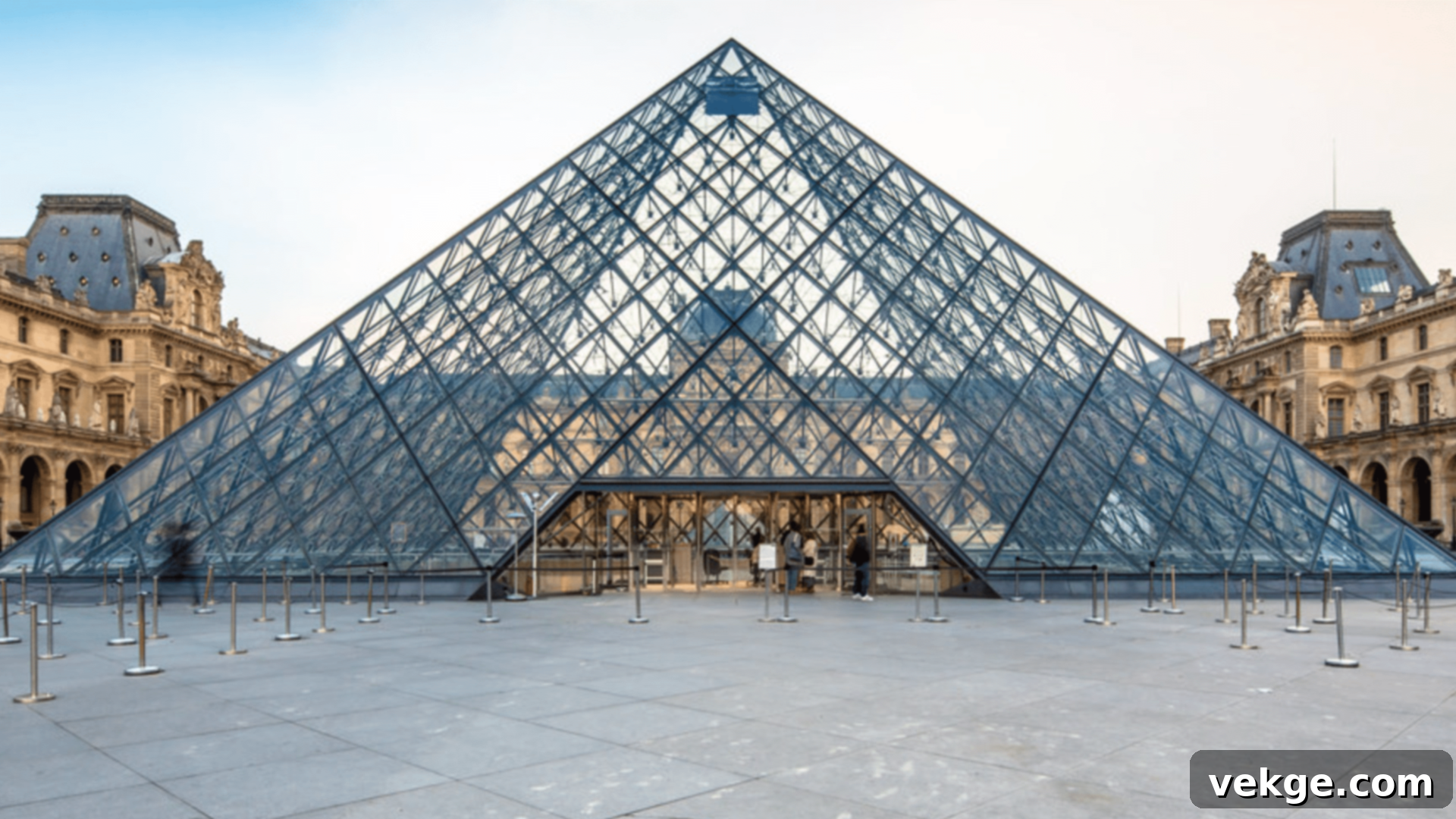 I.M. Pei's modern glass and metal Louvre Pyramid, serving as the main entrance to the historic Louvre Museum in Paris, France.