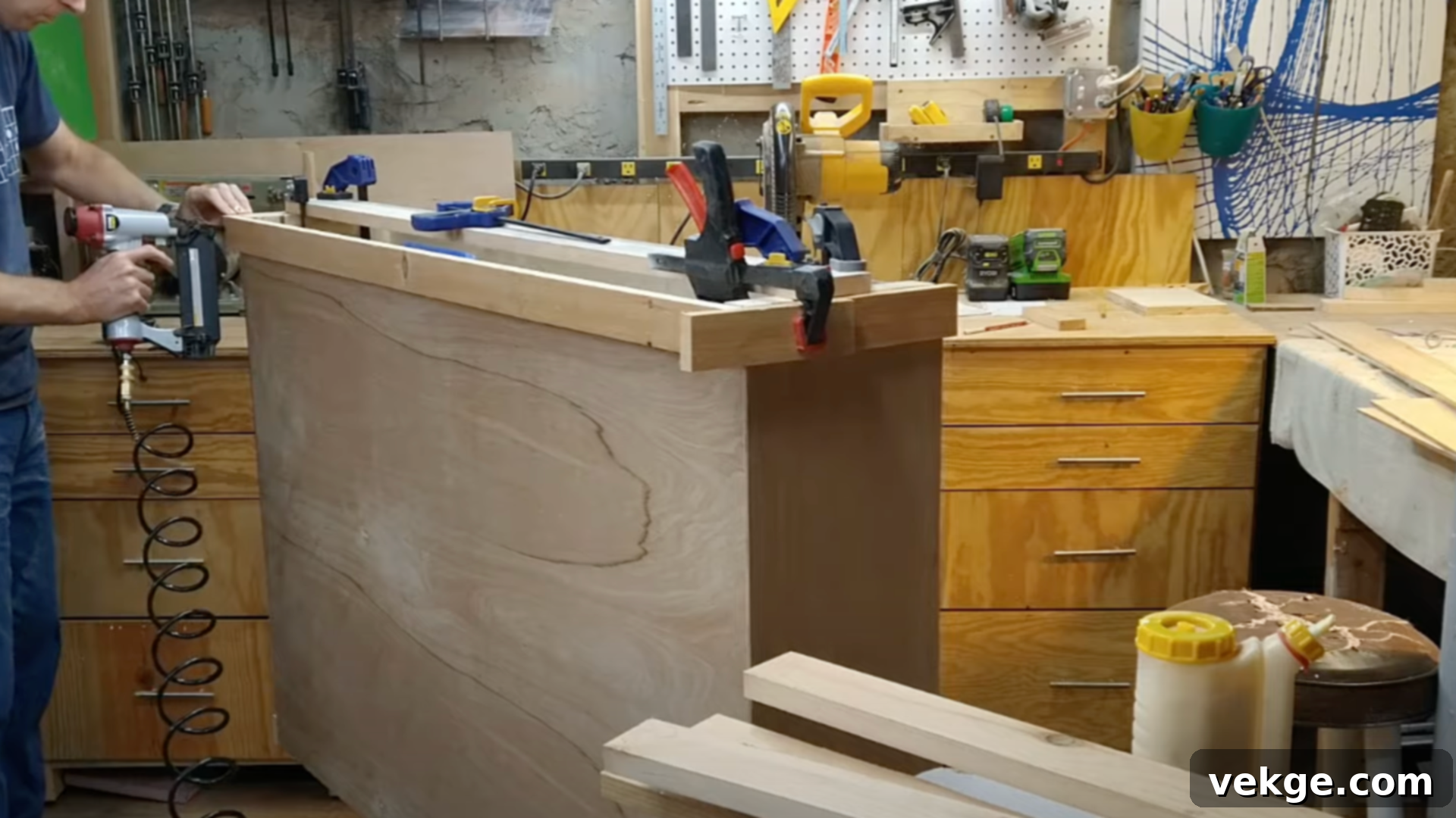 Attaching decorative pine trim to the TV lift cabinet frame