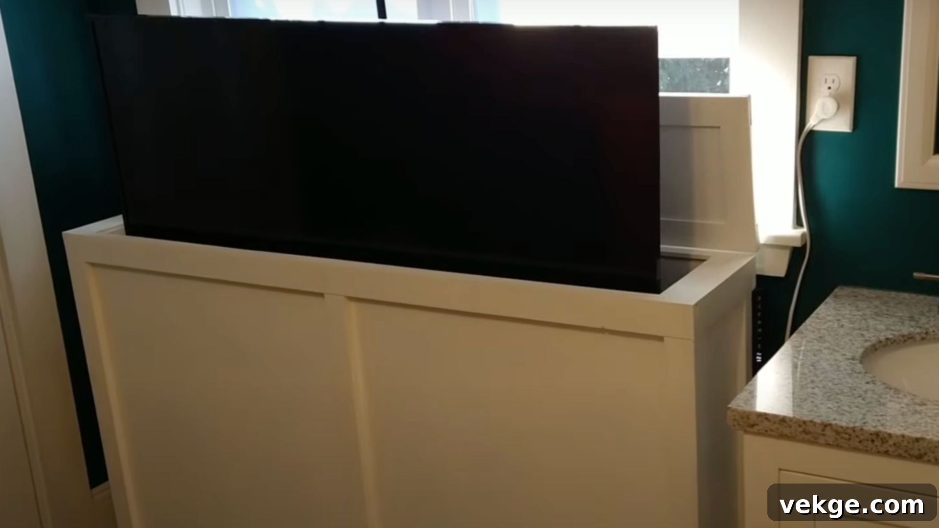Installing the TV lift mechanism inside the cabinet