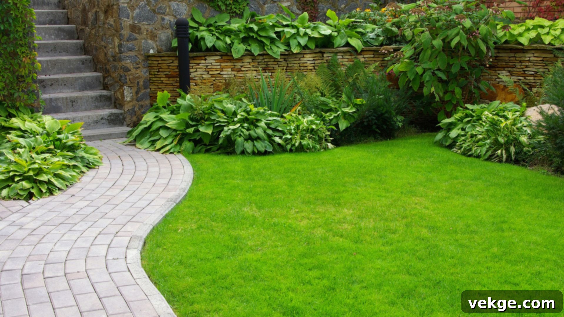 Lush green lawn and vibrant flower beds in a summer garden