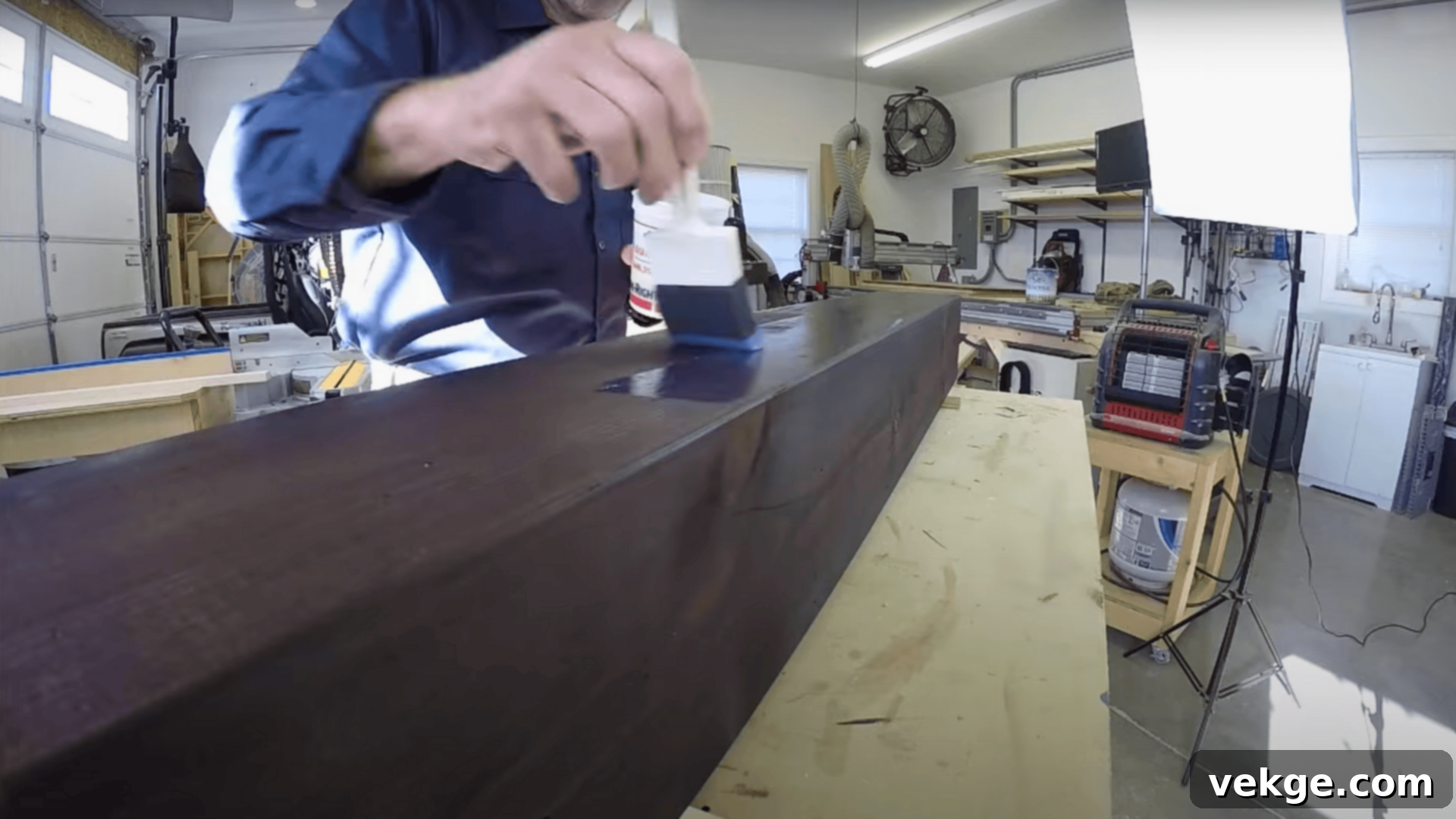 Applying a clear protective finish to a stained faux beam