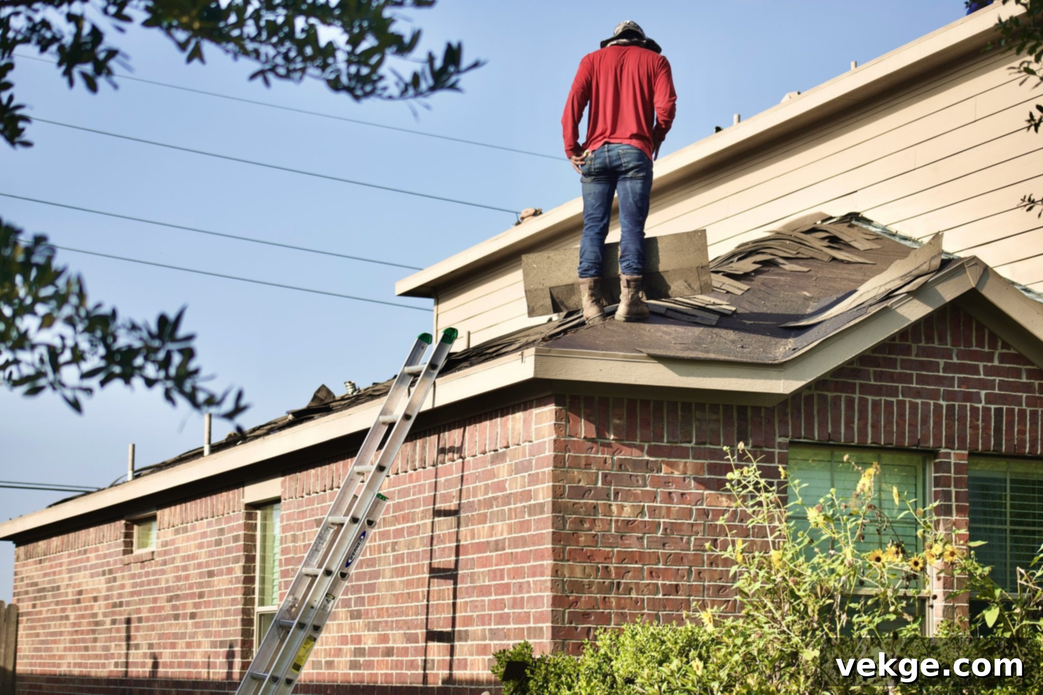 Man working on a roof, symbolizing fast response times for local roofers