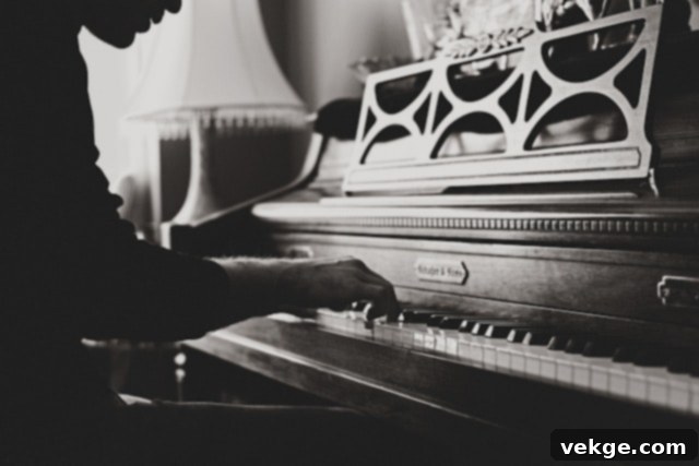 A person's hands gently play the keys of a beautifully restored piano, symbolizing a new beginning for the instrument and the joy of music.
