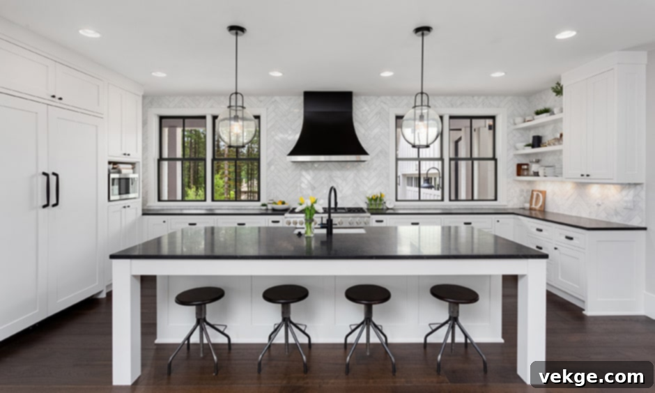 White Kitchen with Mixed Black Hardware and Light Wood Island