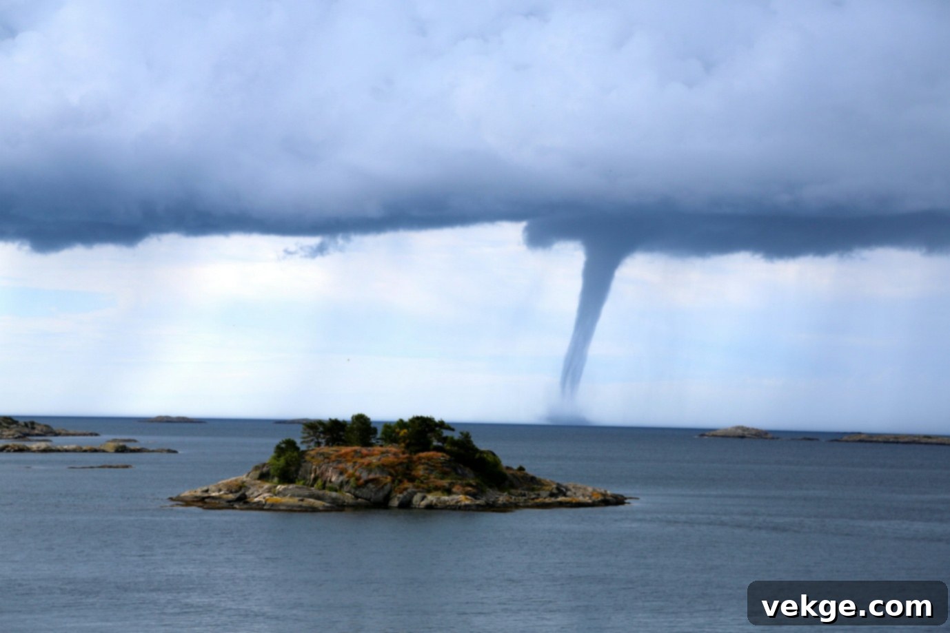 island near tornado, illustrating the powerful and destructive nature of a tornado over water