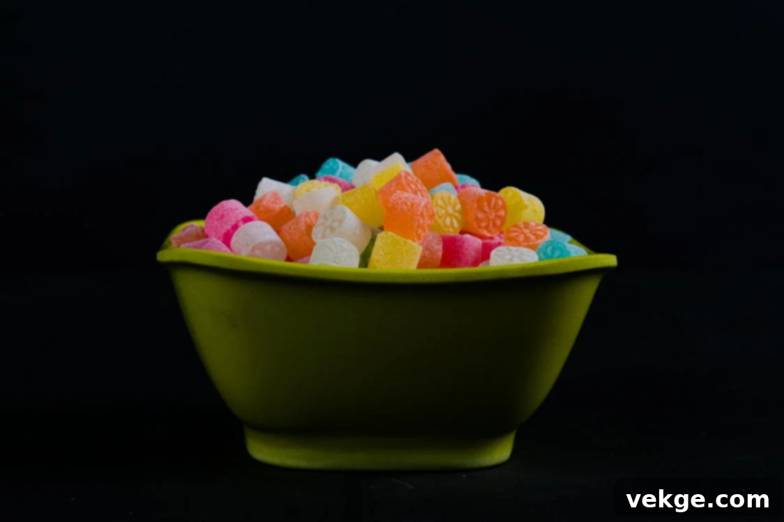 A vibrant bowl filled with an assortment of colorful, sugar-coated CBD gummies, inviting and appealing, representing the variety and potential enjoyment of these products.