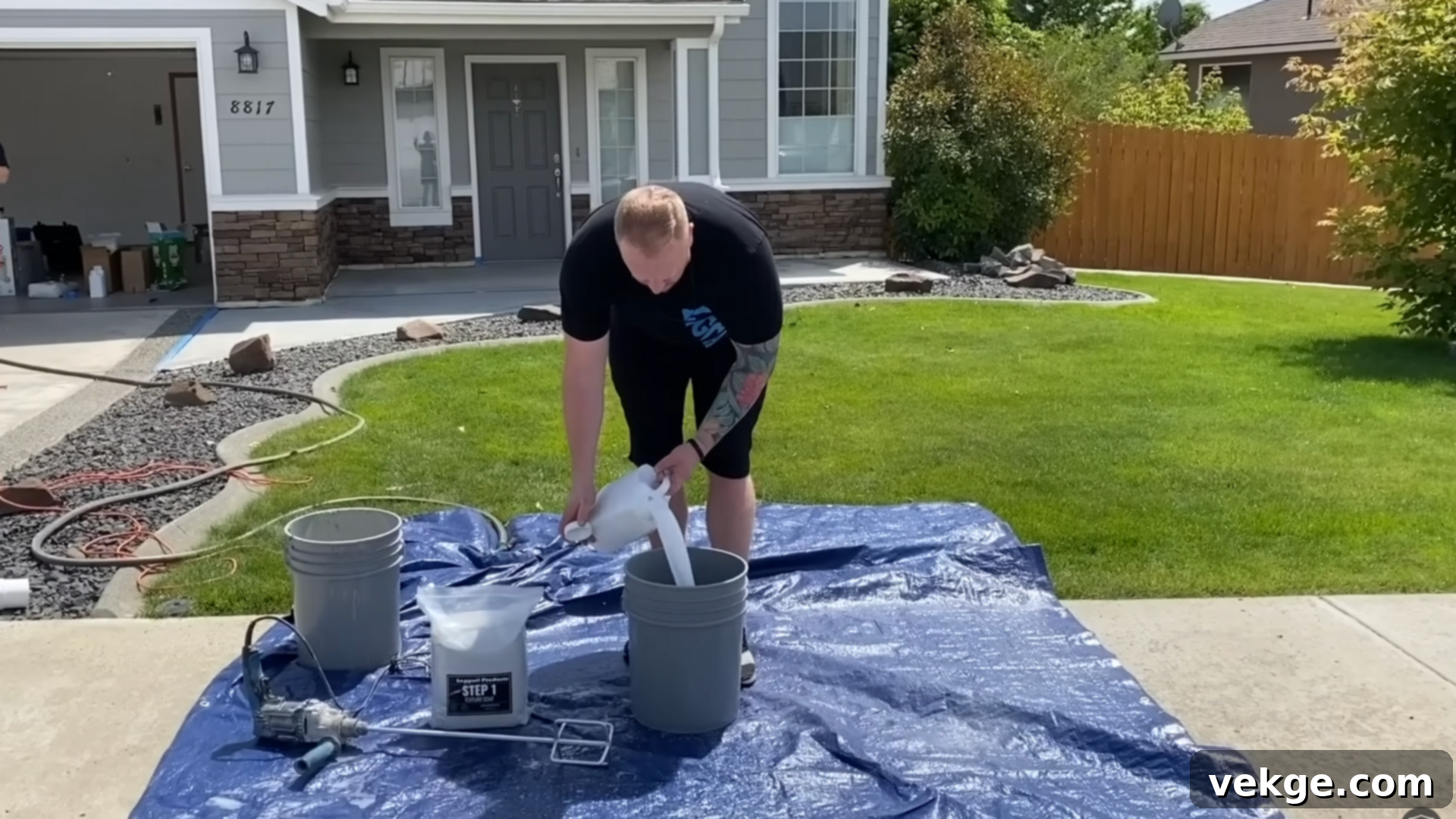 Mixing concrete overlay powder with liquid polymer and modifier using a drill paddle.