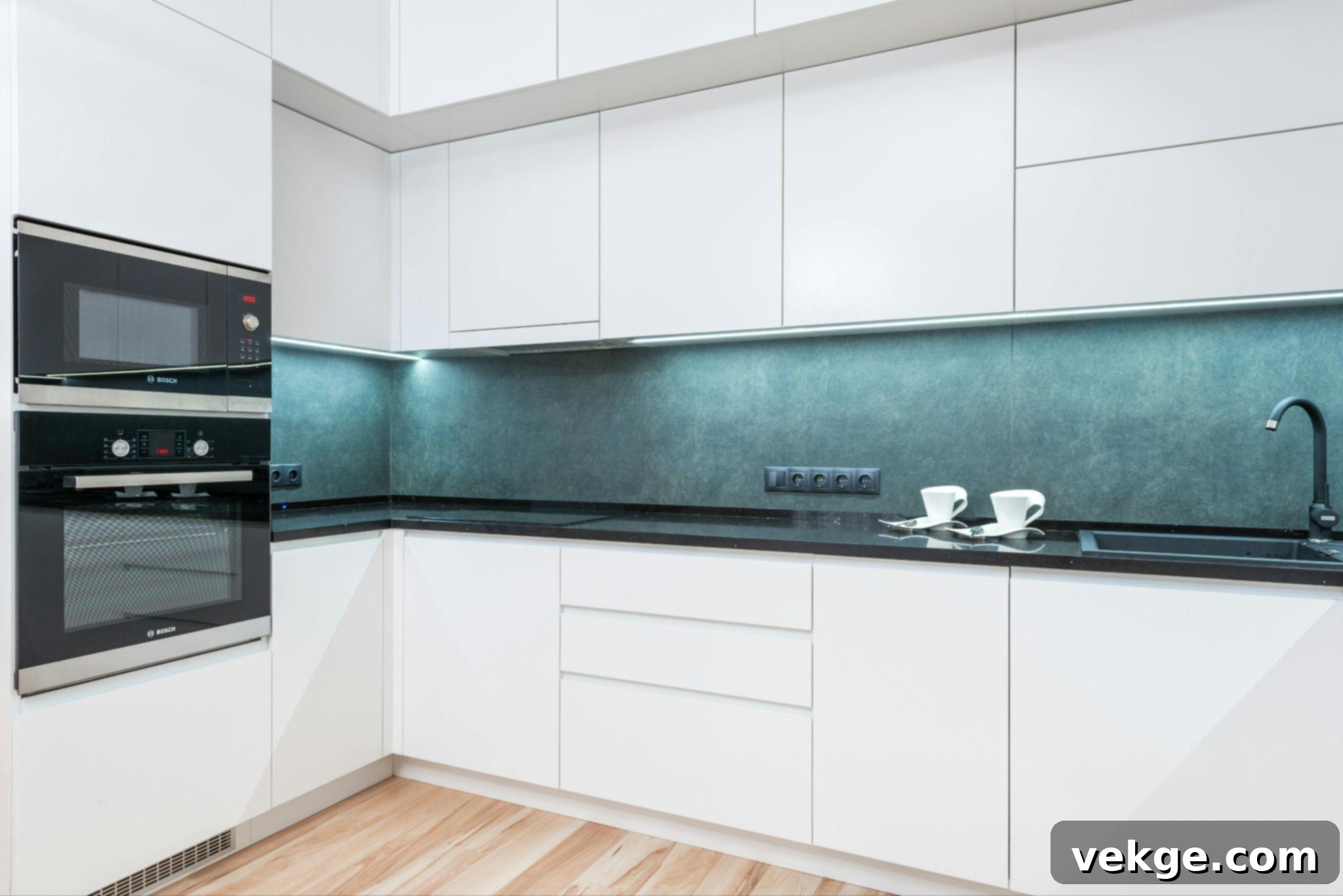 Freshly painted kitchen cabinets in a light, modern color, transforming the kitchen's look