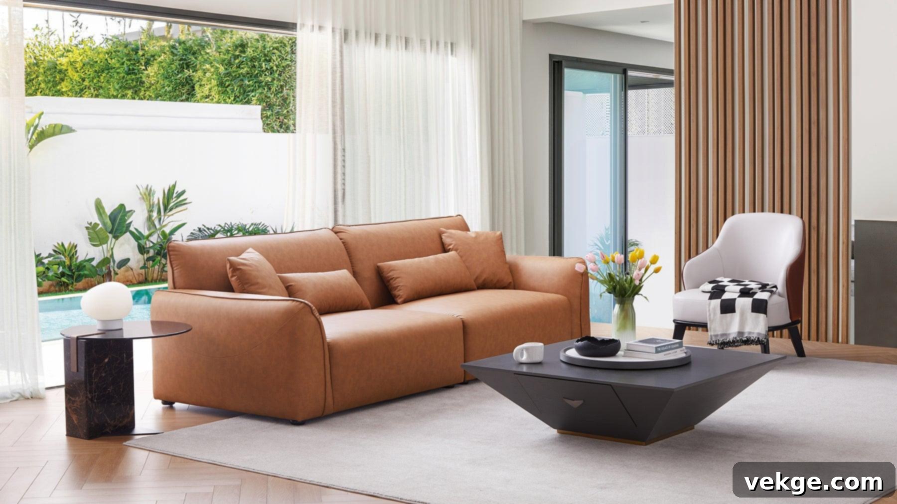 Living room with brown leather sofa and neutral decor