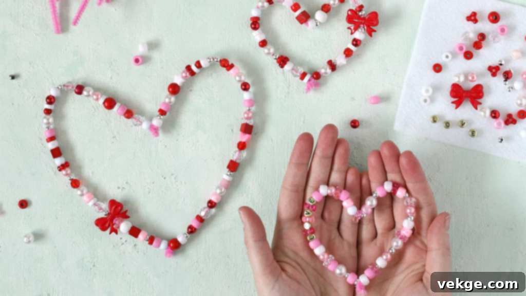 Valentine's Day beaded hearts made with pipe cleaners and red, white, and pink beads.