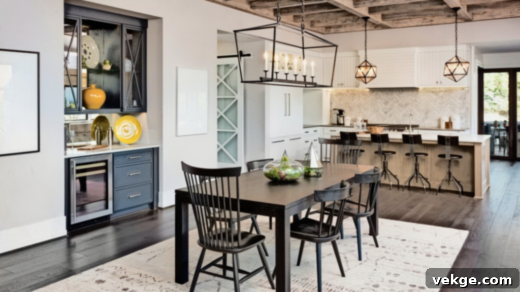 Open-Concept Modern Farmhouse Dining Room with long wooden table and vintage chairs