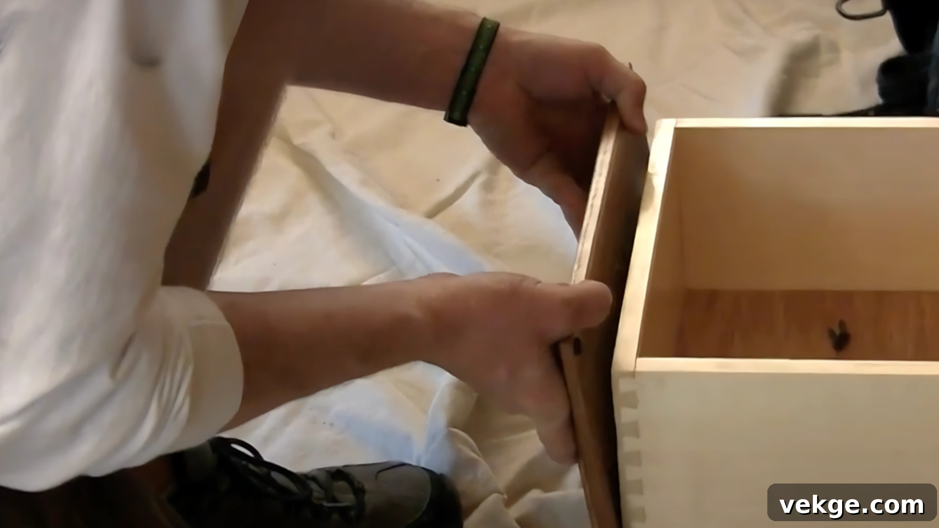 Removing old cabinet doors and drawer fronts, then sanding and cleaning cabinet frames for refacing.