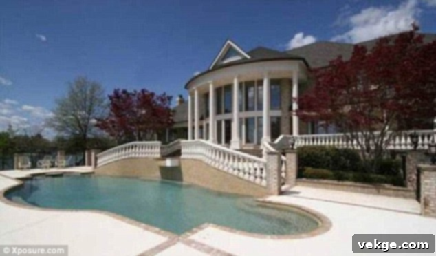 Michael Jordan's tranquil lake house in North Carolina, showcasing ceiling windows and expansive land