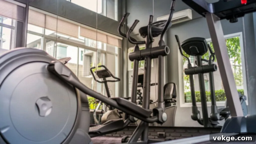 A stylish home gym setup with a sleek black treadmill overlooking a bright, minimalist living space. The room features large windows, natural light, and a clean aesthetic with a focus on functionality and design harmony.