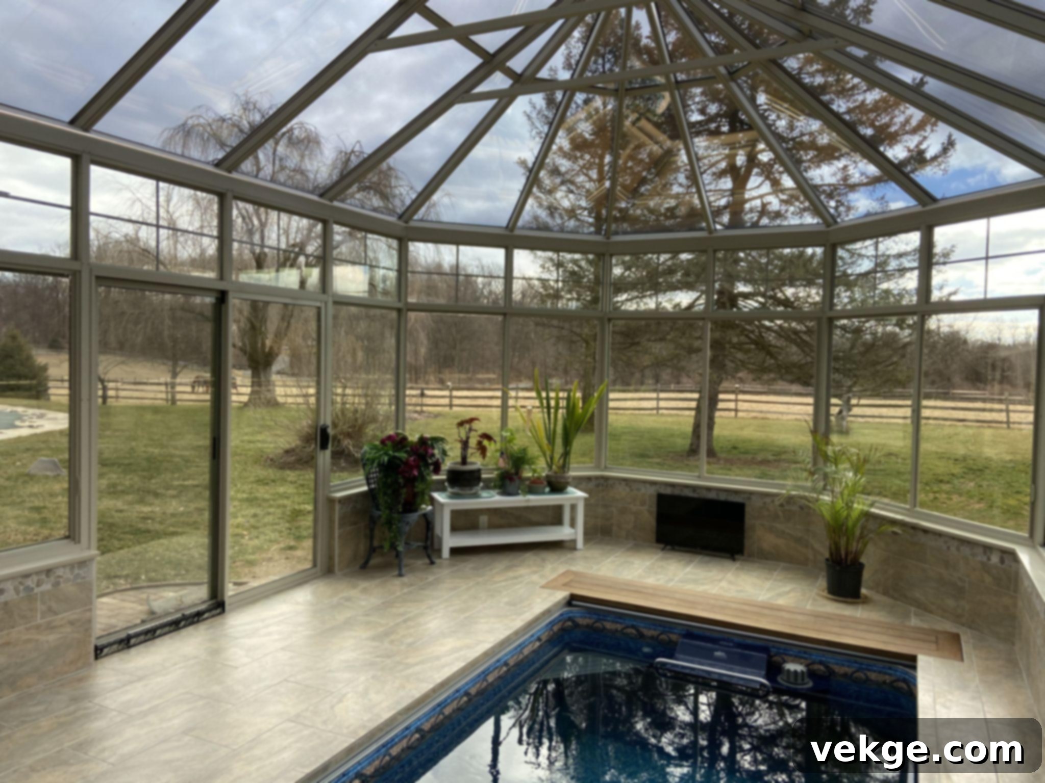 Homeowner reviewing sunroom designs with a contractor, assessing quality