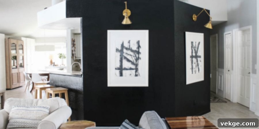 Gallery wall with a single accent color unifying black and white pieces