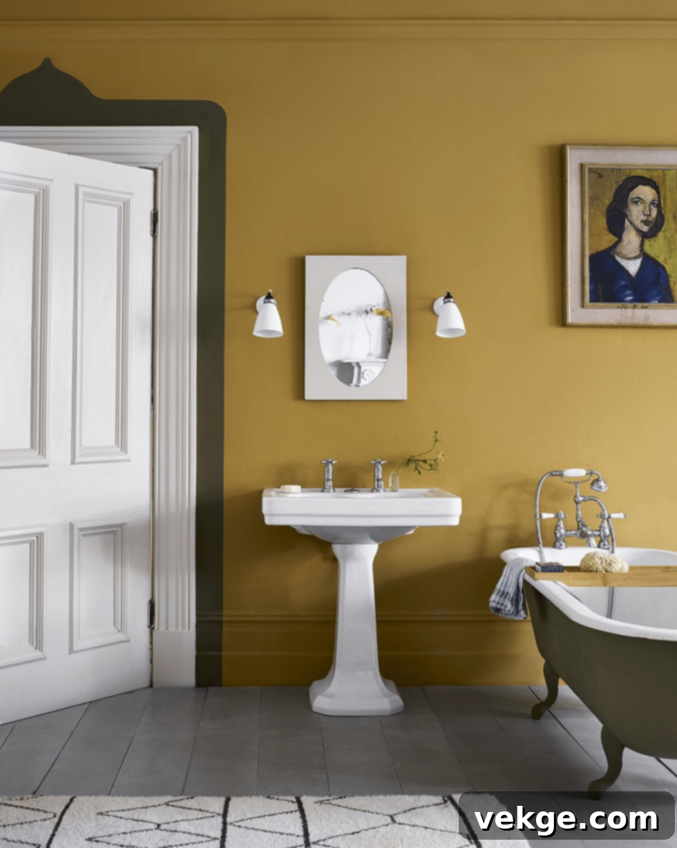 English bathroom with olive green painted bathtub and framed art