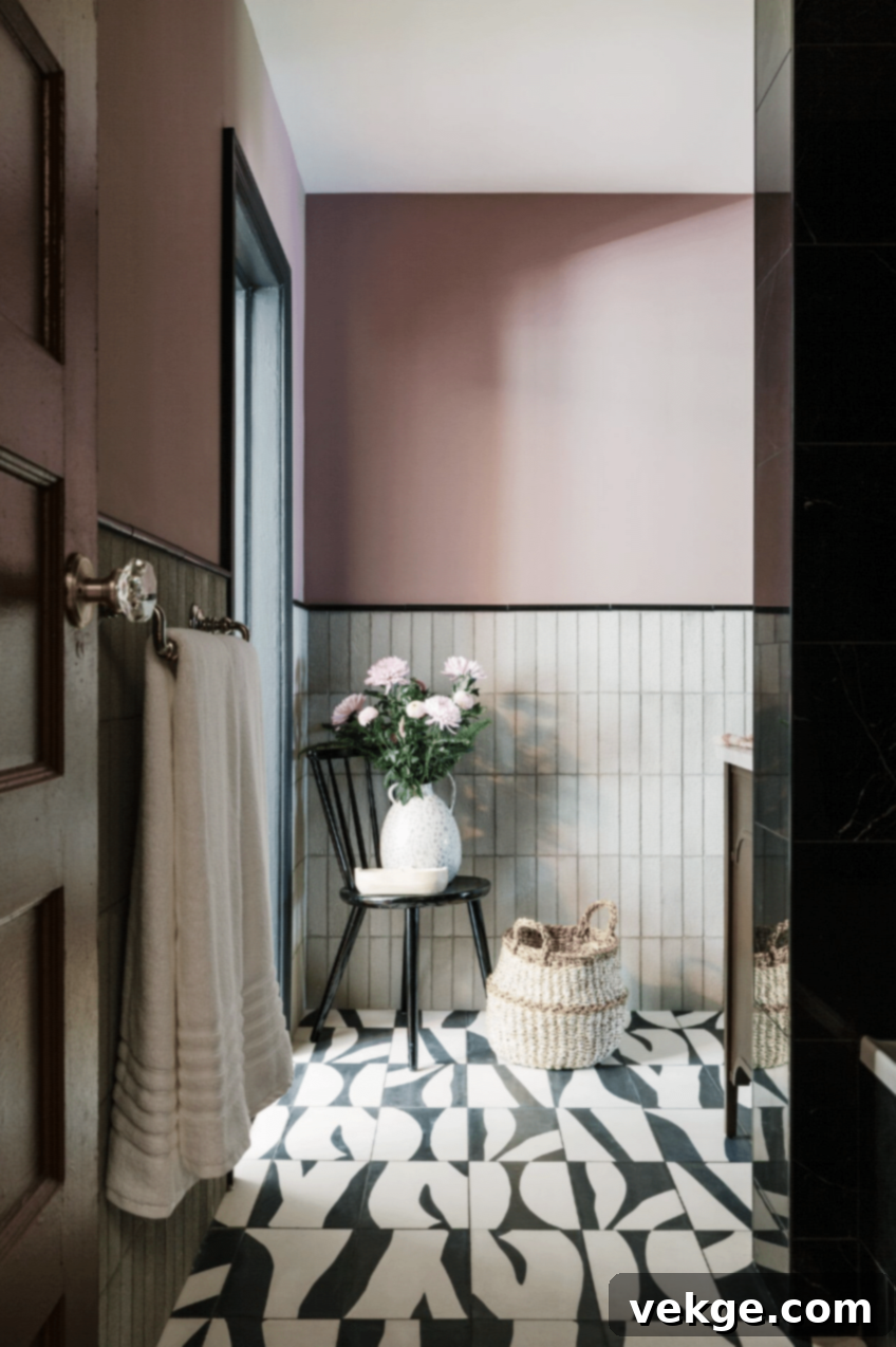 Art-inspired black and white floor tiles in a bathroom