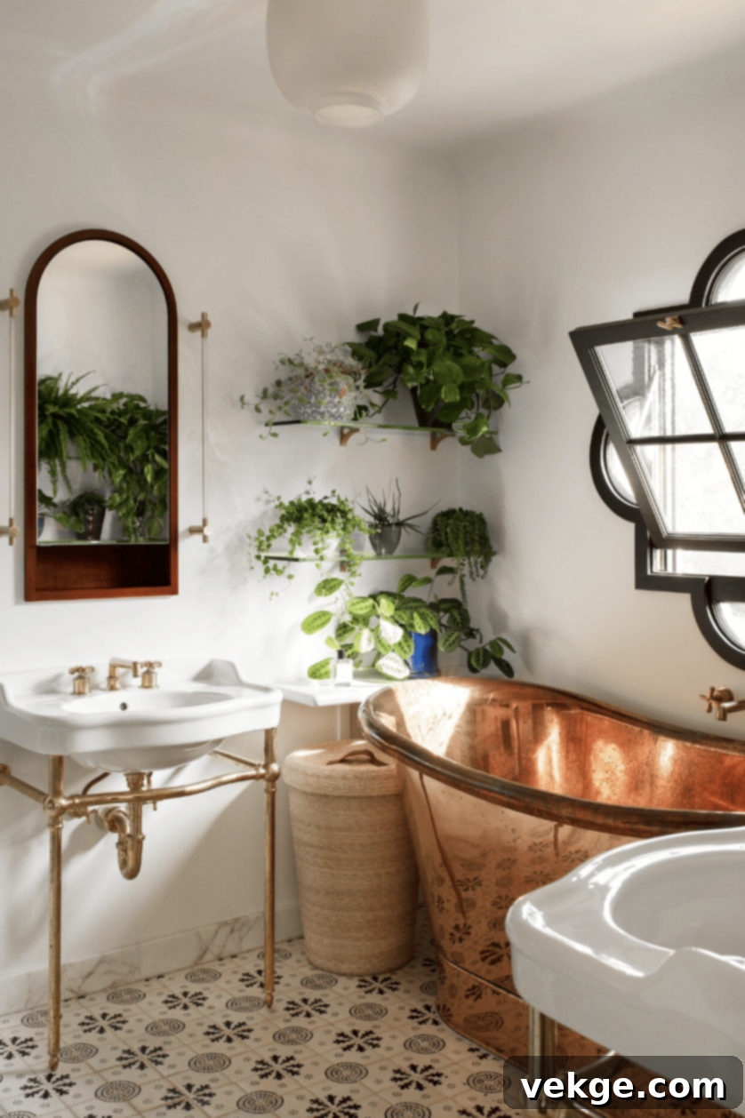 Bathroom with unique windows, pedestal sinks, and open shelving for an airy feel