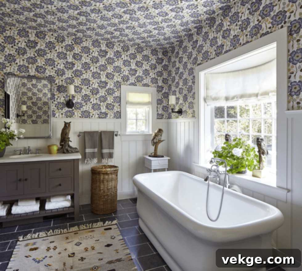 Bathroom preserving original 1920s bay window and flowery wallpaper