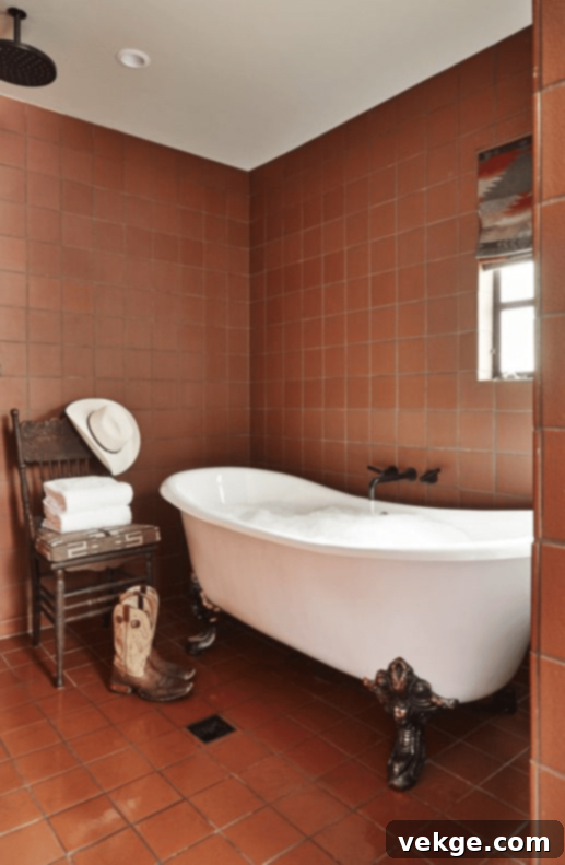 Ranch-style bathroom with terracotta tiles, festive accents, and a cast-iron tub